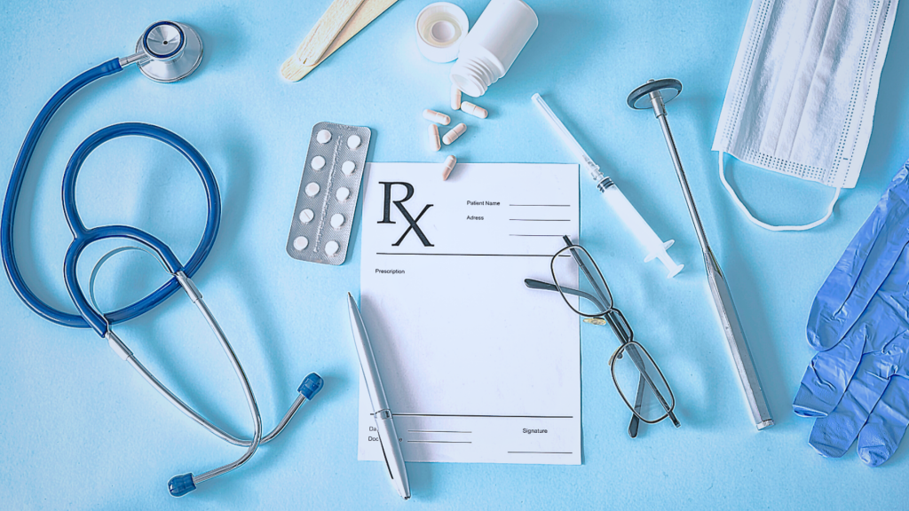 Blank Prescription paper with stethoscope, pen, medication, needle, glove and N-95 mask