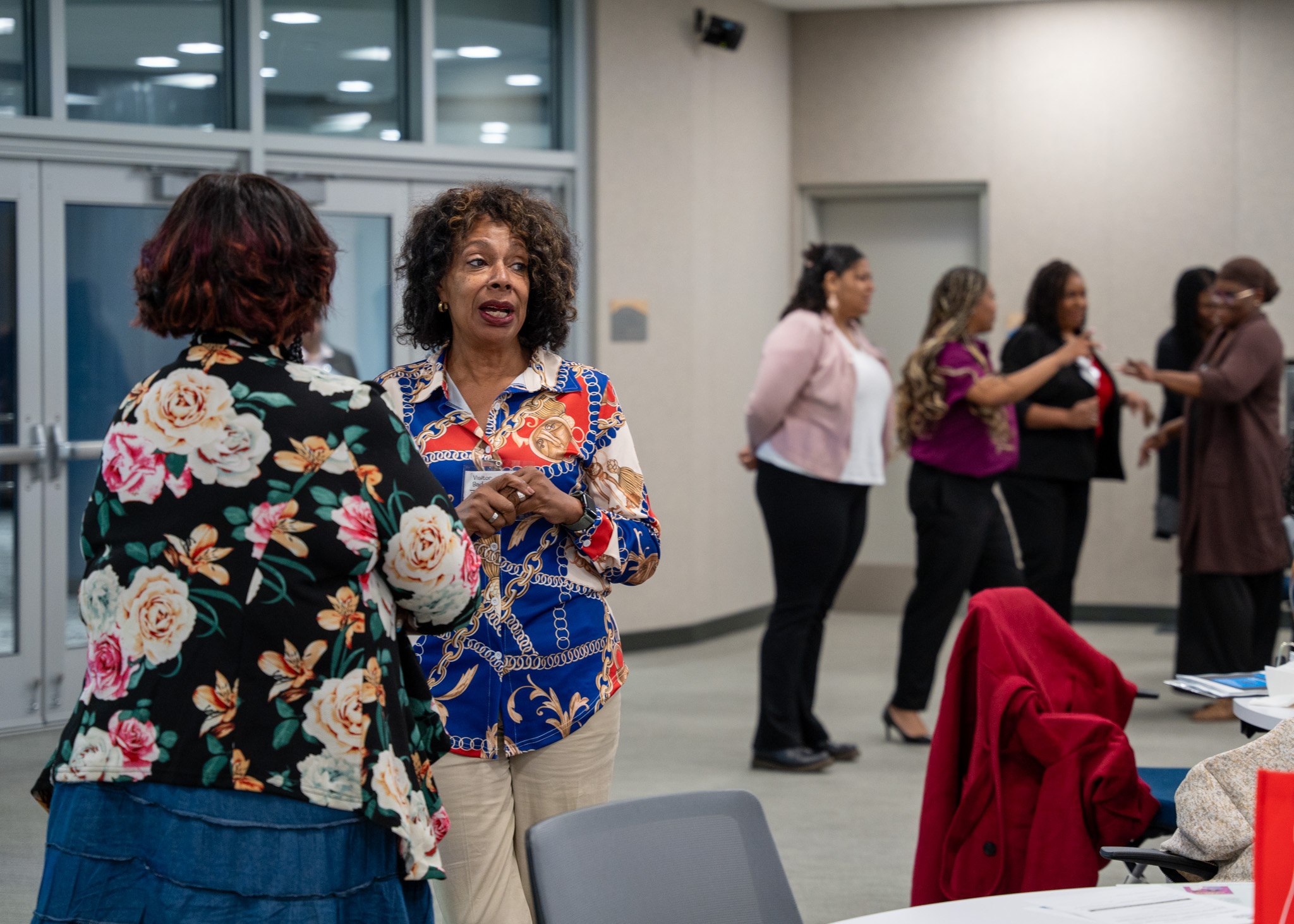 Women speaking casually at the 2024 Perinatal Equity Initiative (PEI) Provider and Community Summit