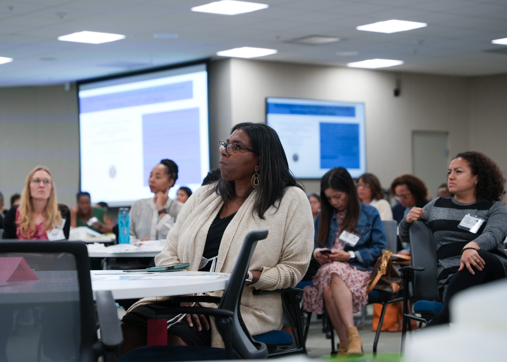 Women listening to speaker at the 2024 Perinatal Equity Initiative (PEI) Provider and Community Summit